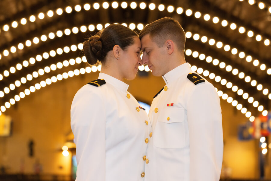 Two midshipmen engaged at Naval Academy.